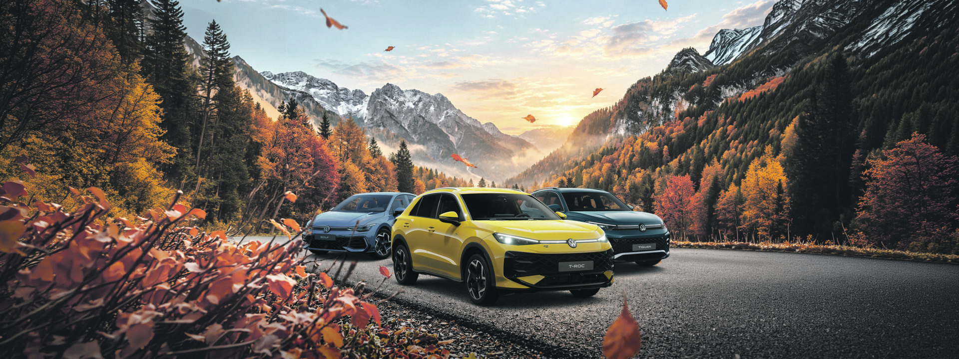 Frischer Wind für stürmische Tage. 1 Drei Autos fahren auf einer Bergstraße mit herbstlich gefärbtem Wald und Bergen im Hintergrund